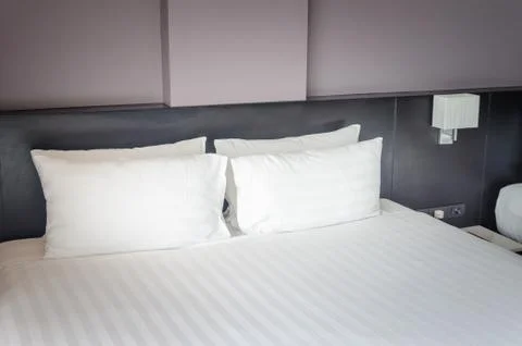 Pillows on bed Stock Photos