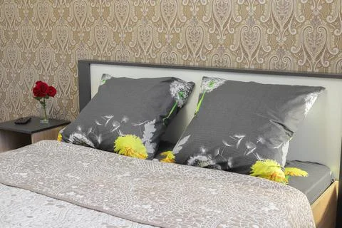 Pillows on the double bed in the bedroom Stock Photos