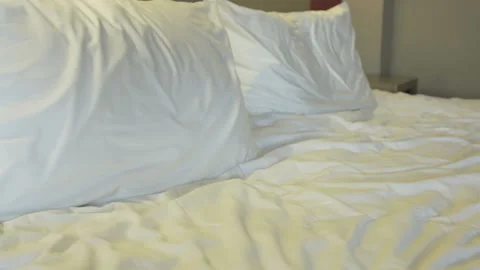 Pillows on a large king-size bed Stock Footage 87542338