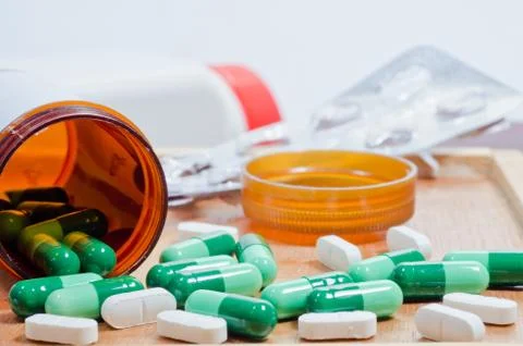 Pills and bottle Stock Photos