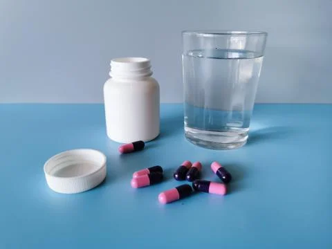 Pills and bottle Stock Photos