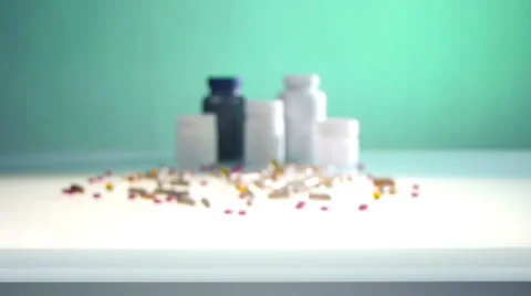 Pills and cans isolated on studio table Stock-Footage 65940009
