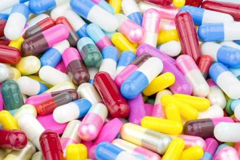 Pills and capsules mix stack use for background close-up Foto stock
