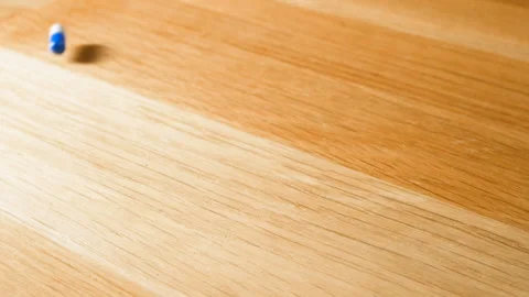 Pills and capsulles is falling on table Video stock 85872099