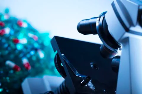 Pills and microscope Stock Photos