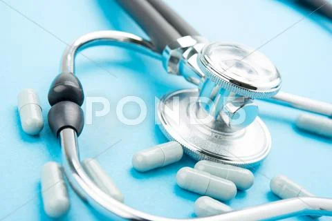 Pills and stethoscope Stock Photos