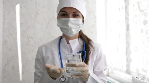 The pills are in the doctor's hands. Hands in medical gloves hold pills Stock Footage 137445226