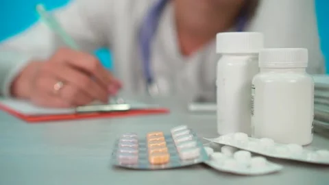 Pills on the background of the doctor Stock Footage 142381287