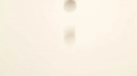 Pills being spilled onto a white surface Video stock 32243954