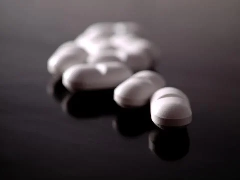 Pills on black Foto stock