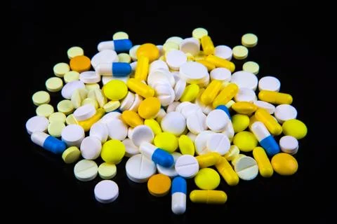 Pills on the Black Stock-Fotos