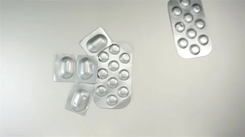 Pills in blisters falling in slow motion Video stock 143426164