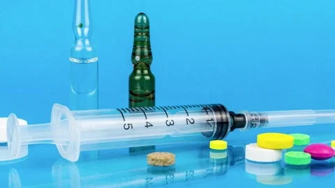 Pills on a blue background Stock Footage 179539031