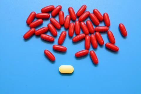 Pills on a blue background Stock Photos