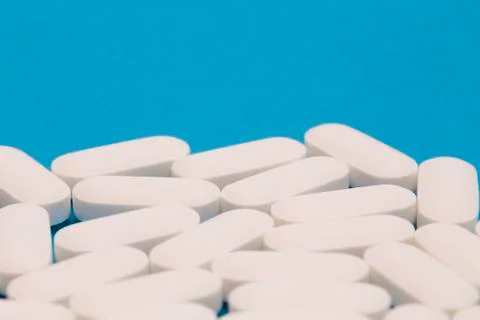 Pills on a Blue Background Stock Photos