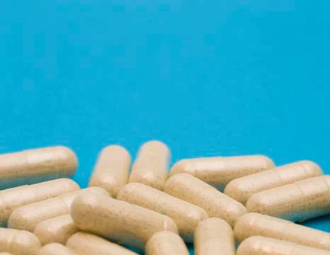 Pills on a Blue Background Stock Photos