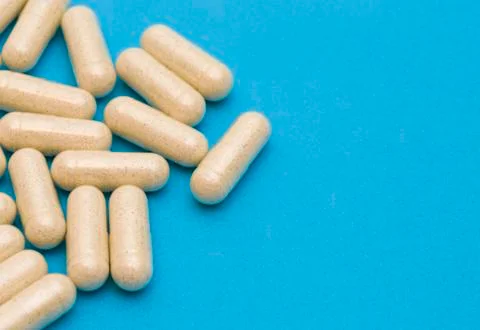 Pills on a Blue Background Stock Photos