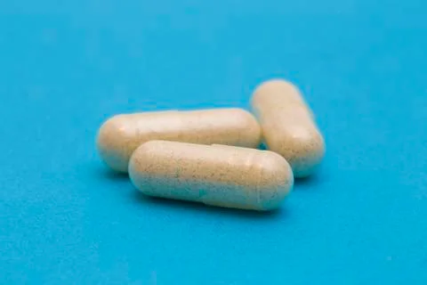Pills on a Blue Background Stock Photos