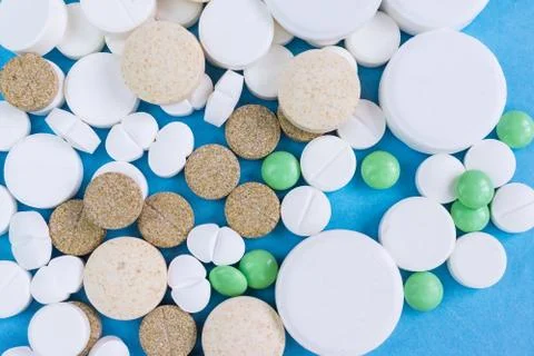 Pills on a blue background Stock Photos