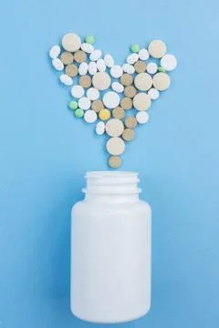 Pills on a blue background Stock Photos