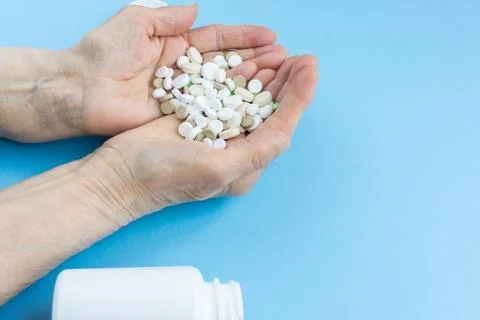 Pills on a blue background Stock Photos