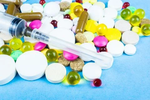 Pills on a blue background Stock Photos