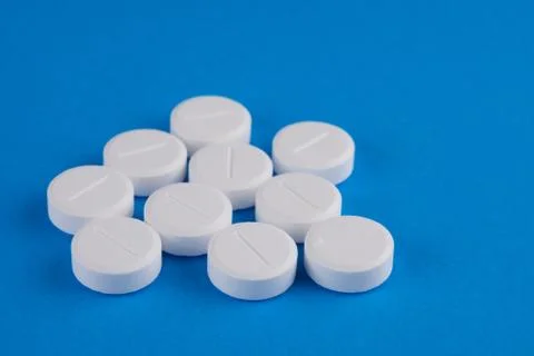 Pills on blue background 스톡 사진