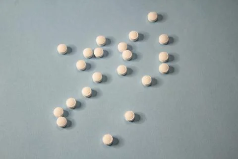 Pills on blue background Stock Photos