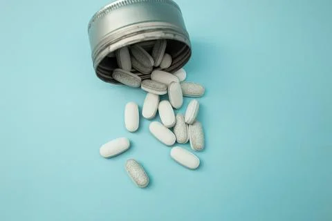 Pills on a blue background Stock Photos