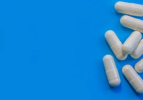 Pills border over blue Stock Photos