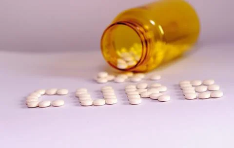 Pills with bottle in background 2 Stock Photos
