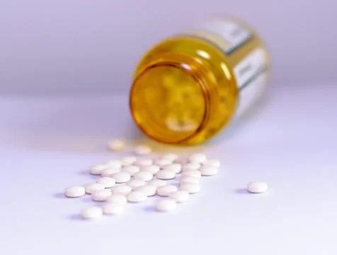 Pills with bottle lying Stock Photos