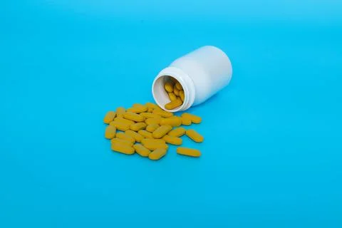 Pills from a bottle Stock Photos