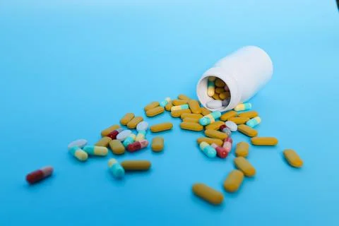 Pills from a bottle Stock Photos