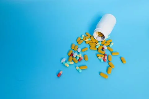 Pills from a bottle Stock Photos