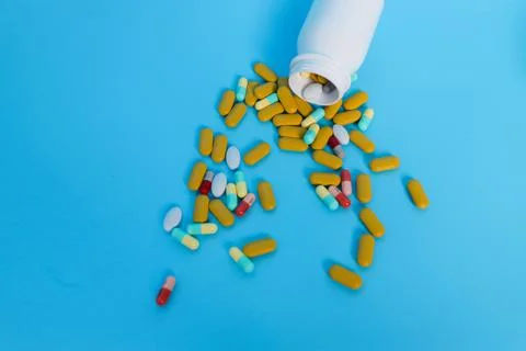 Pills from a bottle Stock Photos
