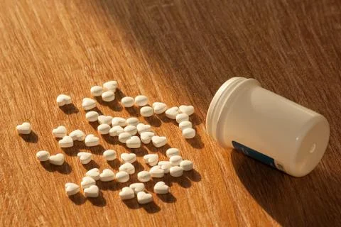Pills with a bottle on the table Stock Photos