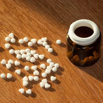 Pills with a bottle on the table Stock Photos