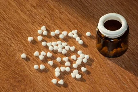 Pills with a bottle on the table Stock Photos