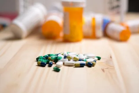 Pills with bottles in the background Stock Photos