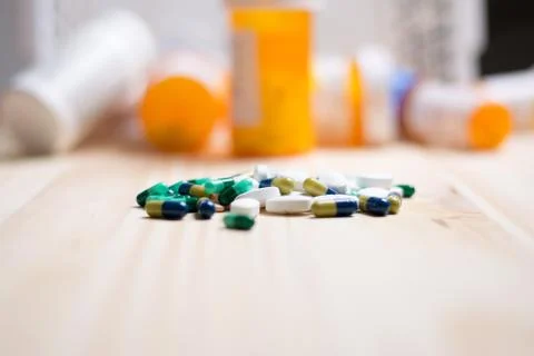 Pills with bottles in the background Stock Photos