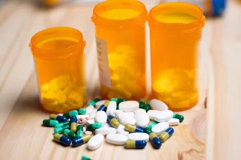 Pills with bottles in the background Stock Photos