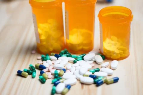 Pills with bottles in the background Stock Photos