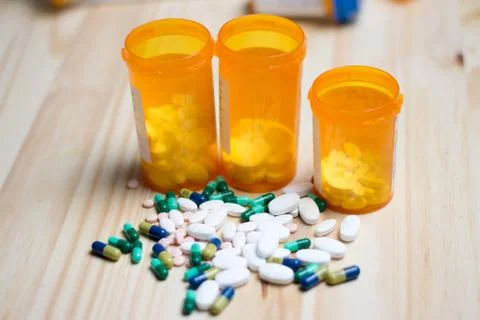 Pills with bottles in the background Stock Photos