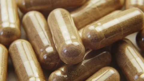 Pills capsules with biologically active additives rotation macro shot 库存影片 155142162