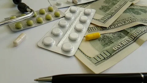 Pills capsules falling dollars Stock Footage 88494391