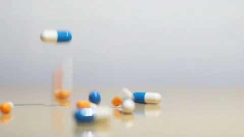 Pills capsules which falling down. Stock Footage 75400736
