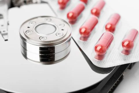 Pills on computer hard drive - concept technology background 스톡 사진