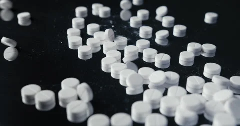 Pills crumbled on a black background Stock Footage 142236035