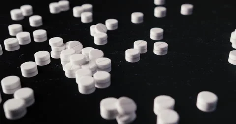 Pills crumbled on a black background Stock Footage 142236136